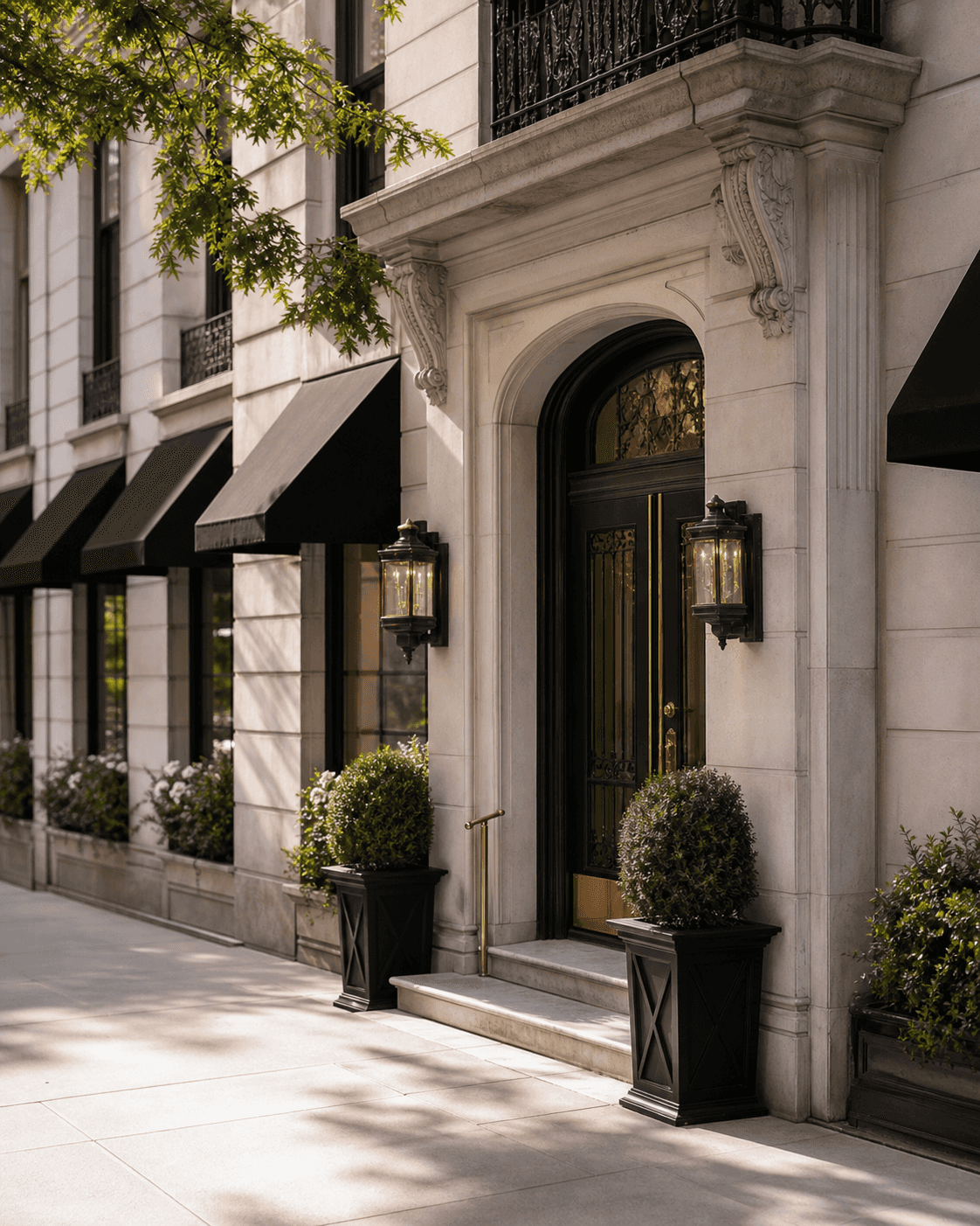 Prewar Manhattan apartment building entrance with black awnings